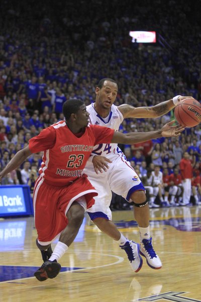 KU's Travis Releford (24) gets control against Southeast Missouri State's Marland Smith (23) on Friday at Allen Fieldhouse.