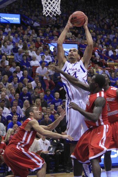 KU's forward Perry Ellis (34) skies above Southeast Missouri State defenders on Friday at Allen Fieldhouse.
