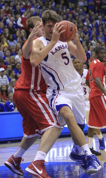Kansas center Jeff Withey works the paint against Southeast Missouri's Colin Ferguson on Friday at Allen Fieldhouse.