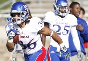Kansas running back Taylor Cox practices receiving kickoffs prior to the start against Texas Tech on Saturday, Nov. 10, 2012 at Jones AT&T Stadium in Lubbock, Texas.