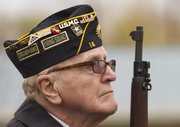 Veteran John McCoin, Lawrence, listens as Taps is played during a Veterans Day ceremony at American Legion Dorsey-Liberty Post 14 on Sunday. The ceremony was a joint event by the American Legion, Disabled American Veterans and Veterans of Foreign Wars.