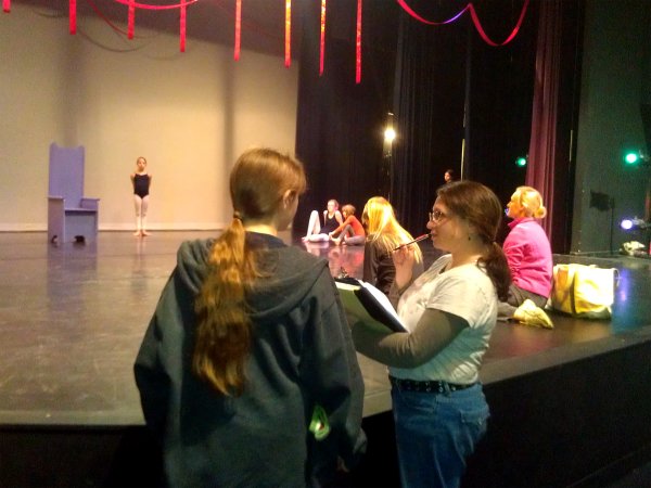 Jenifer Harmon, foreground, right, discusses technical cues with apprentice stage manager Caelon Rogers for the Arts Center's upcoming production of "The Red Ribbon."