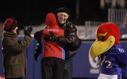 Kansas University professor of design Philip Hofstra is congratulated after being announced as the 2012 HOPE Award recipient during a break in action from Saturday night's football game at Memorial Stadium. Recipients of the HOPE Award, which stands for Honor for an Outstanding Progressive Educator, are nominated by students from the senior class to recognize excellence in teaching.