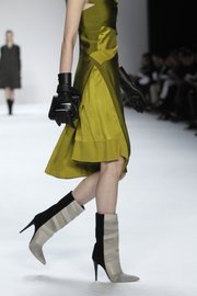 Spice up winter outfits by wearing skirts and dresses with boots, like these from the Narciso Rodriguez Fall 2012 collection modeled during Fashion Week in New York on Feb. 14, 2012.