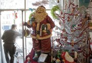 A retro Santa greets visitors to Hobbs, 700 Massachusetts St. From retro to regal, Lawrence stores are putting out a variety of Christmas decorating styles this season.