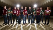 The Journal-World All-Area football team, from left: Gabe Cleveland, Eudora; Tye Hughes, Free State; Nick Becker, Eudora; Erick Mayo, Lawrence; Dayton Valentine, Baldwin; player of the year Brad Strauss, Lawrence; coach of the year Bob Lisher, Free State; Kyle McFarland, Free State; Kharon Brown, Lawrence; Cody Stanclift, Free State; and Markis Hill, Eudora.