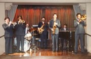 Members of the Gaslight Gang, from left, Paul Gray, Tommy Johnson, Mark Olson, Paul Miller, Doug Talley, Wayne Hawkins, Early Braggs perform in 1985.