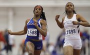 Kansas sprinter Paris Daniels slows after the finish of the women's 60-meter dash at the Bob Timmons Challenge on Thursday, Dec. 6, 2012 in Anschutz Pavillion at Kansas University. At right is Latoya King of Lincoln.