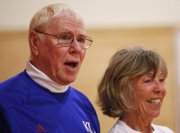 Former KU physical education instructor Bob Lockwood, a pioneer of plyometric training, watches the workout with Liberty Memorial Central teacher Michel Loomis.