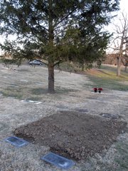 The graves of convicted and executed murderers Richard Hickock, left, and Perry Smith, right, sit side by side in Mount Muncie Cemetery after the exhumation and reburial of their remains on Tuesday in Lansing. Their killings of a family in 1959 inspired Truman Capote&squot;s book, "In Cold Blood," and Florida authorities believe they may be tied to decades-old killings there.