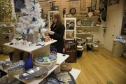 Kelsey Richardson, Lawrence, looks over some of the fair trade items for sale last month at Ten Thousand Villages, 835 Massachusetts St.