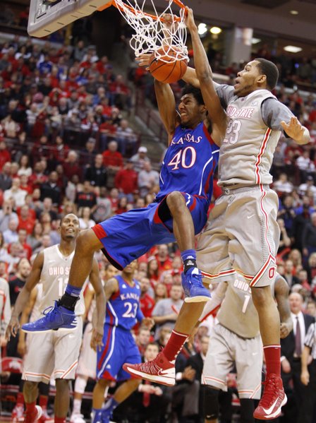 Kansas forward Kevin Young finishes a dunk and gets a foul from Ohio State center Amir Williams during the first half on Saturday, Dec. 22, 2012 at Schottenstein Center in Columbus, Ohio.