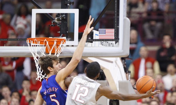 Kansas center Jeff Withey looks for a block against Ohio State forward Sam Thompson during the first half on Saturday, Dec. 22, 2012 at Schottenstein Center in Columbus, Ohio.