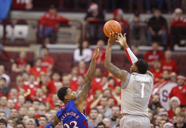 Kansas guard Ben McLemore reaches to defend against a three from Ohio State forward Deshaun Thomas during the first half on Saturday, Dec. 22, 2012 at Schottenstein Center in Columbus, Ohio.