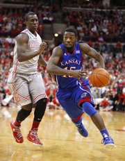 Kansas guard Elijah Johnson drives against Ohio State guard Shannon Scott during the second half on Saturday, Dec. 22, 2012 at Schottenstein Center in Columbus, Ohio.