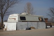 Permanent residents of Campground 3 at Clinton State Park take measures to insulate trailers from the winter temperatures, such as adding skirting around the base like this one. Some trailers are better equipped than others, and a few less fortuante residents stay in tents or vans.