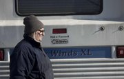 With the daytime temperature in the mid-20s, Gene Wallace walks around his RV at Campground 3 at Clinton State Park. Unlike some of the permanent residents at the campsite, Wallace, his wife and their two cats — who lived in Lawrence before becoming full-time RV residents in August 2011 — were not prepared to weather the winter in their vehicle but found themselves stuck after transmission repairs and a hotel stay set them behind financially.