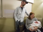Maurice and Marjorie Baker look with their newborn daughter, Alexis, in their room at Lawrence Memorial Hospital on Tuesday. Alexis, born at 2:51 a.m. Tuesday, was the first baby of 2013 in Lawrence.