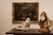 "Empire of Things" at the Spencer Museum of Art includes art objects from a variety of time periods, regions and mediums. Here, "Mary Magdalene," left, by Bernardino Ludovisi, and "Bust of a Woman," by Henri Jacobs, are pictured in front of Gillis van Tilborgh&squot;s painting, "A Picture Gallery."