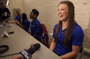Andrea Geubelle, right, answers a question during Kansas University's track and field media day on Thursday, Jan. 17, 2013, at Allen Fieldhouse.