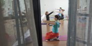 "Heart Flow" yoga class members participate in a noon session at OmTree Shala yoga studio, Thursday, Jan. 17, 2013.