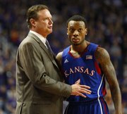Kansas head coach Bill Self talks with guard Naadir Tharpe during a break in action against Kansas State on Tuesday, Jan. 22, 2013 at Bramlage Coliseum.