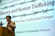 Kansas Gov. Sam Brownback introduces keynote speaker and anti-slavery activist Kevin Bales during Kansas University’s first Kansas Conference on Slavery and Human Trafficking in Woodruff Auditorium at the Kansas Union. Thursday’s event opened a two-day symposium looking at ways to fight modern-day slavery around the globe.