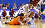 Oklahoma State guard Marcus Smart comes away with a steal from Kansas guard Ben McLemore late in the second half on Saturday, Feb. 2, 2013 at Allen Fieldhouse.