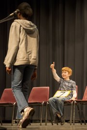 South Middle School sixth-grader Aidan Pierce gives Abena a thumbs up after she correctly spelled “triage” during the Douglas County Spelling Bee on Saturday at Southwest Middle School. Abena won the spelling bee by correctly spelling the world "stabilizer," while Aidan came in second. Both will advance to the regional spelling bee in Topeka.