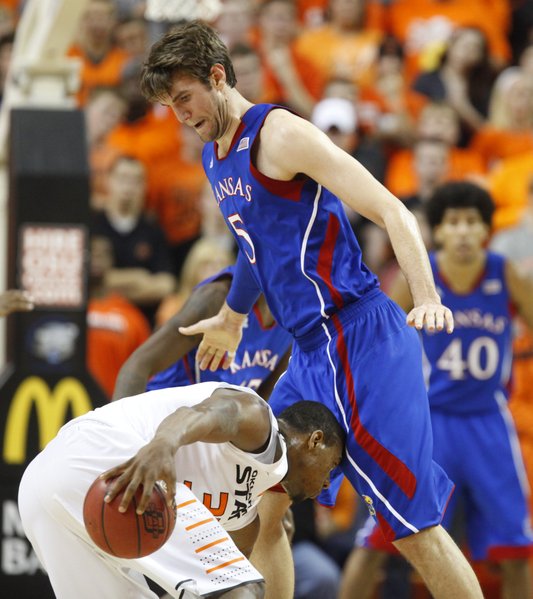 Kansas center Jeff Withey blocks a drive by Oklahoma State guard Marcus Smart during the first half on Wednesday, Feb. 20, 2013 at Gallagher-Iba Arena in Stillwater, Oklahoma.