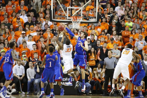 Kansas center Jeff Withey smothers a shot by Oklahoma State guard Marcus Smart during the first half on Wednesday, Feb. 20, 2013 at Gallagher-Iba Arena in Stillwater, Oklahoma.