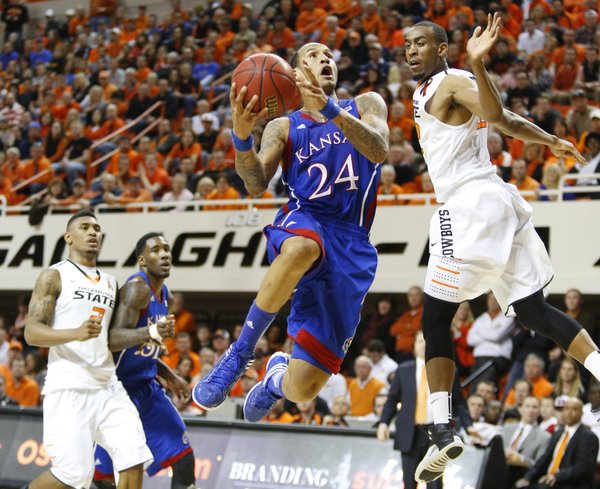 Kansas guard Travis Releford pulls up for a bucket past Oklahoma State guard Markel Brown during the first half on Wednesday, Feb. 20, 2013 at Gallagher-Iba Arena in Stillwater, Oklahoma.