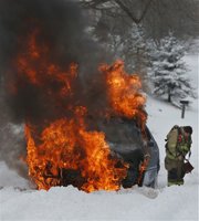 Fire crews extinguish a car fire in the 1300 block of Lawrence Avenue at about 12:10 p.m. Crews extinguished two car fires in Lawrence on Thursday afternoon, according to Lawrence-Douglas County Fire Medical shift supervisors. Another car caught fire in the 600 block of Florida St. In each case, the vehicle accidentally caught fire while struggling in today's snowstorm.