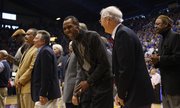 Kansas great Jo Jo White laughs with former Jayhawks coach Ted Owens during a halftime ceremony recognizing 115 years of basketball at KU, Saturday, Feb. 23, 2013 at Allen Fieldhouse.