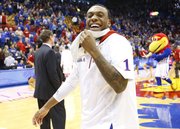 Kansas guard Naadir Tharpe smiles after some words from head coach Bill Self following the Jayhawks' 91-65 win over West Virginia on Saturday, March 2, 2013 at Allen Fieldhouse.