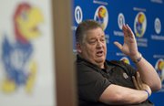 KU football coach Charlie Weis speaks to reporter about the depth chart during a spring football practice news conference Monday, March, 4, 2013, at KU. KU will begin spring drills today and will practice five times before taking a week off for spring break. The annual spring game, is slated for a 1 p.m. kickoff on April 13 at Memorial Stadium..