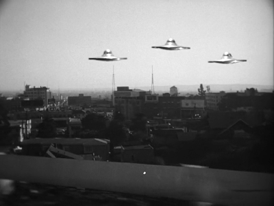 Plan 8 involved the saucers flying low over major cities with the aliens leaning out the windows waving and yelling "Hey! Look up here!"