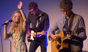 From left, Heather Johnson sings while Jackson Swain and Andrew Shaw, all of Lawrence, play during a Velocity Church service March 10, 2013, at the Lawrence Arts Center, 940 New Hampshire St.