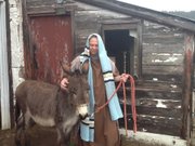 Tom Sack from Family Church of Lawrence prepares for the Palm Sunday Parade, which will take place this weekend. The procession starts about 9 a.m. at the church, 1601 New Hampshire St.