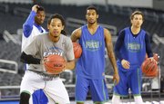 Florida Gulf Coast player Sherwood Brown makes a move to the bucket during a day of practices and press conference for teams in the South Regional at Cowboys Stadium in Arlington, Texas on Thursday, March 28, 2013.