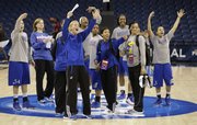 Members of the Kansas women's basketball team welcome their teammates during practice for the NCAA regional games in Norfolk, VA., Saturday, March 30, 2013.