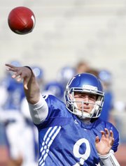 Kansas quarterback Jake Heaps throws a pass during a spring practice on Tuesday, April 2, 2013, at Memorial Stadium.