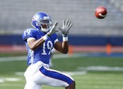 Kansas receiver Justin McCay makes a catch during a spring practice on Tuesday, April 2, 2013 at Memorial Stadium.