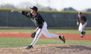 Free State reliever Sam Hearnen throws to the plate in the third inning against Olathe Northwest on Thursday, April 4, 2013, at Free State High School.
