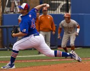Kansas' Drew Morovick delivers a pitch as Texas' Weston Hall leads off of third base during Kansas' game against Texas Sunday afternoon at Hoglund Ballpark.
