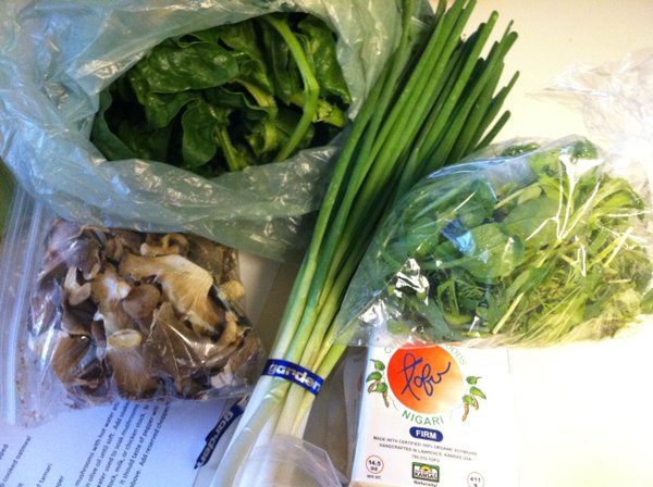 Dried mushrooms, spinach, green onions, tofu and salad greens.