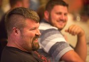 Christian Cantwell, foreground, and Joe Kovacs share a laugh during a dinner Tuesday, April 16, 2013, at the Eldridge Hotel in downtown Lawrence. The pair will compete today in the men’s elite pro shot put event at the Kansas Relays at the Douglas County Fairgrounds.