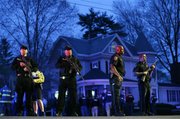 Police officers guard the entrance to Franklin street where there is an active crime scene search for the suspect in the Boston Marathon bombings, Friday, April 19, 2013, in Watertown, Mass. Gunfire erupted Friday night amid the manhunt for the surviving suspect in the Boston Marathon bombing, and police in armored vehicles and tactical gear rushed into the Watertown neighborhood in a possible break in the case. Police have one suspect in custody