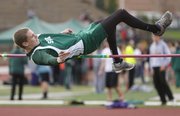 Free State freshman Aric Trent clears the bar on an attempt in the boys high jump event on Monday, April 22, 2013 at Free State High School.