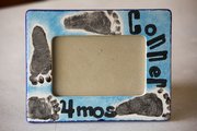 A ceramic picture frame decorated with baby footprints at Sunfire Ceramics ($18 includes frame and paint fee).